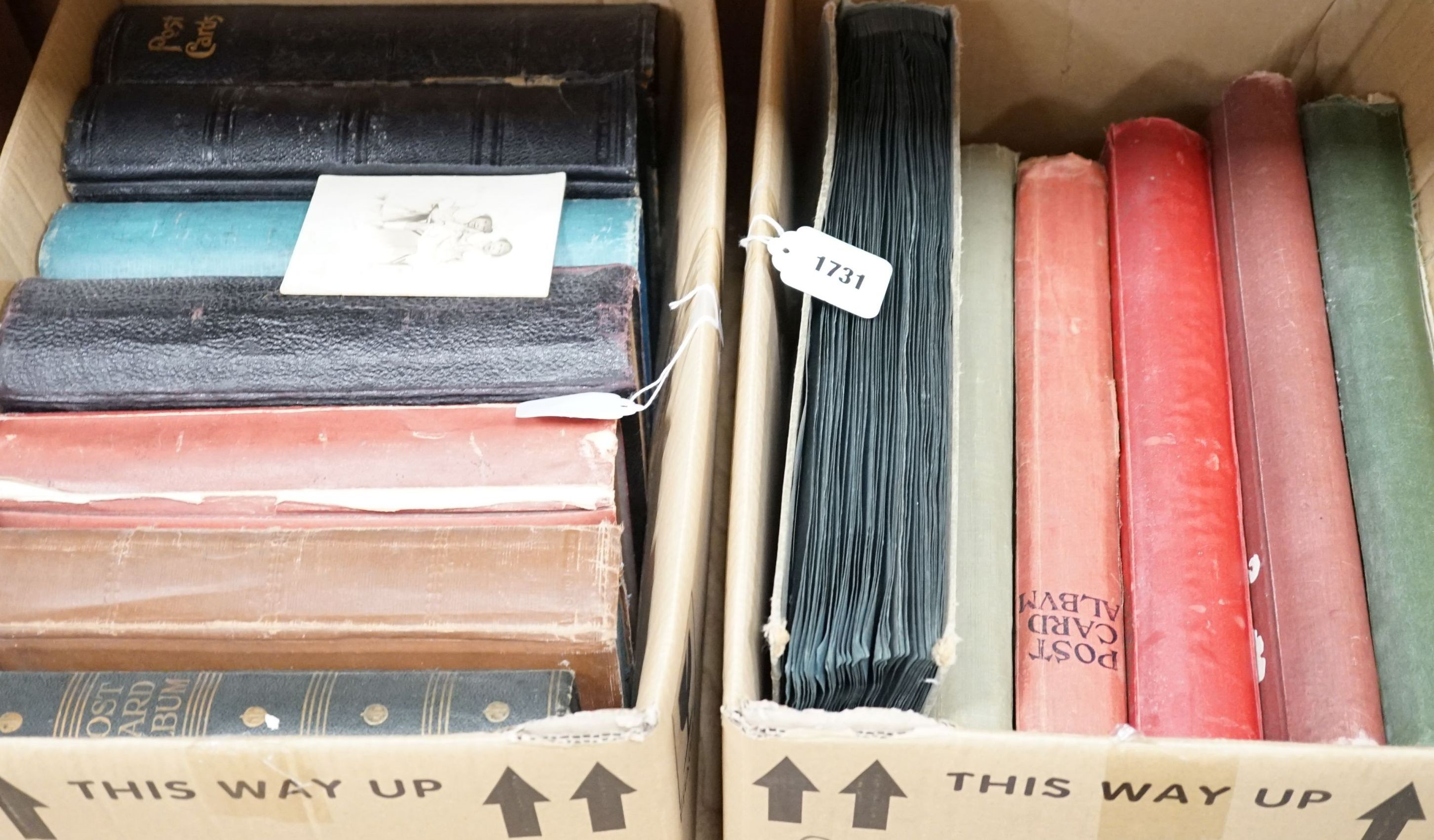 Thirteen early to mid 20th century postcard albums, mostly topographical of scenes of the UK and some of the Continent, including a few greeting cards. (Two boxes)